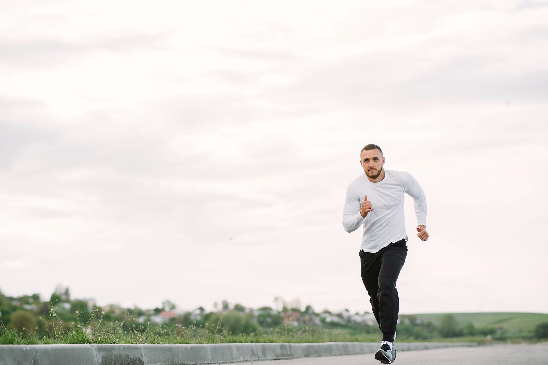 Runner training outdoors for Best training app for shoe and gear tracking.