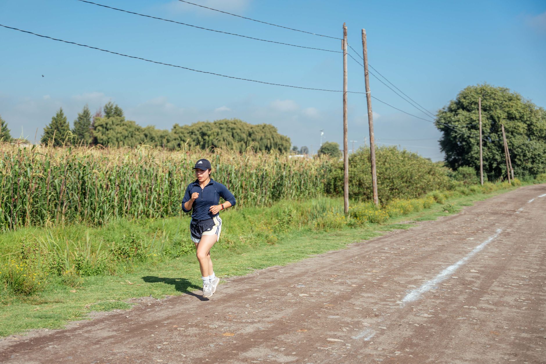 Runner training outdoors for Best running app for half-marathon training.