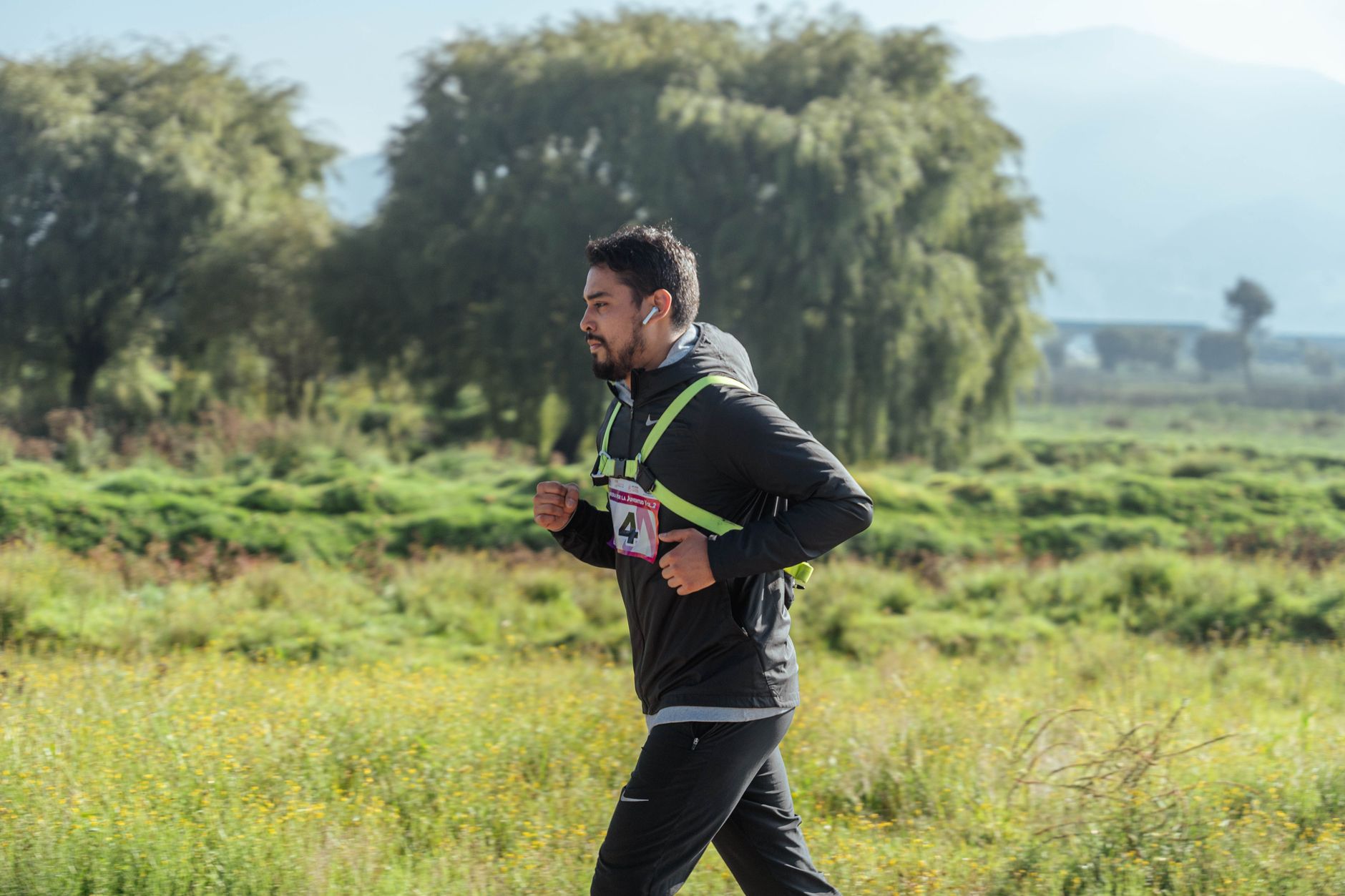 Runner training outdoors for Best marathon app for missed-session adjustments.